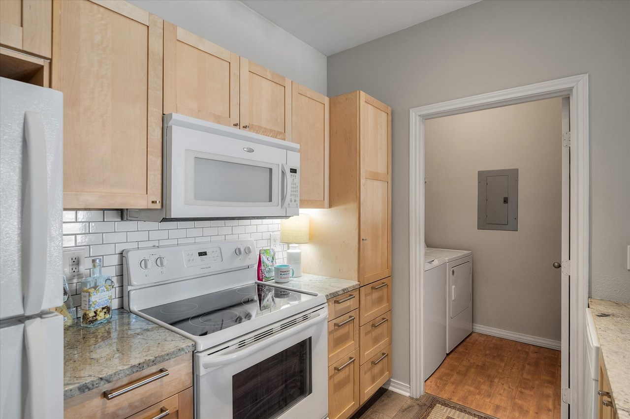 smooth top range with granite counters the kitchen has new cabinets with soft close doors!