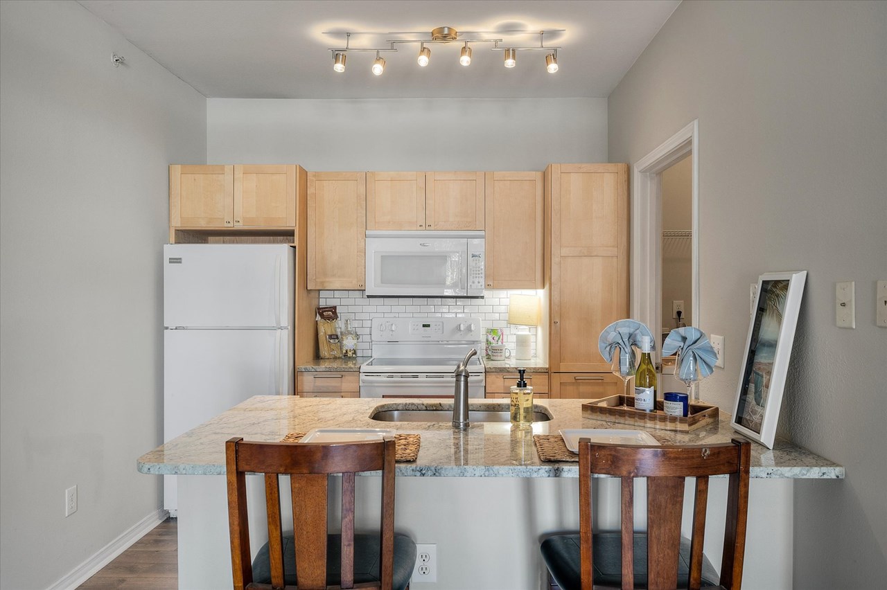kitchen kitchen also has a deep stainless sink, and garbage disposal.