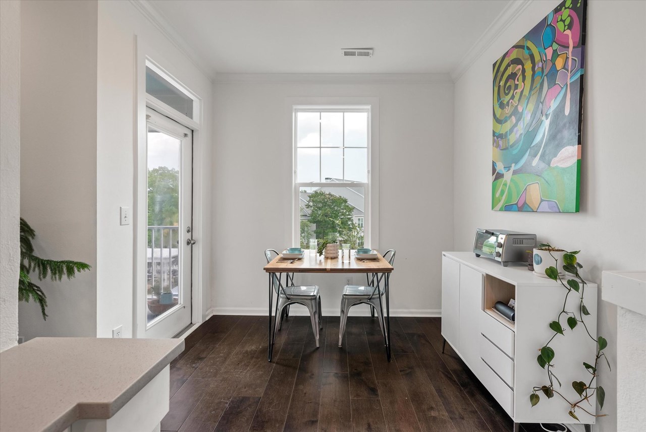separate dining nook! have a cup of coffee and enjoy the morning sun while looking out over the egrets and palm trees!