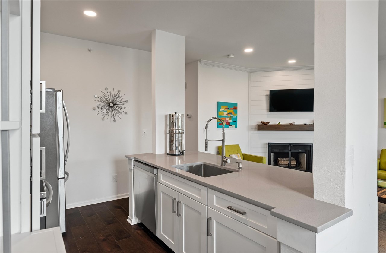 fully renovated kitchen with quartz new 42' cabinets, shiny quartz counters and new stainless lg appliances!